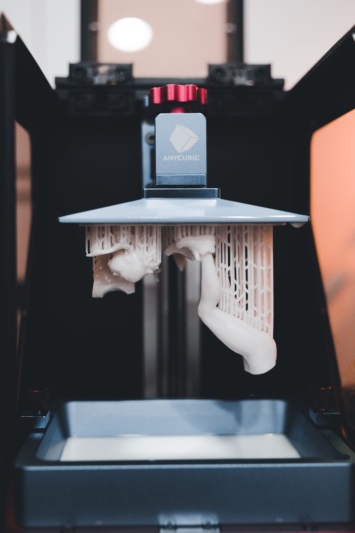 Crafting Captivating Headlines: Your awesome post title goes here High-quality close-up of a 3D printer printing an object with resin.