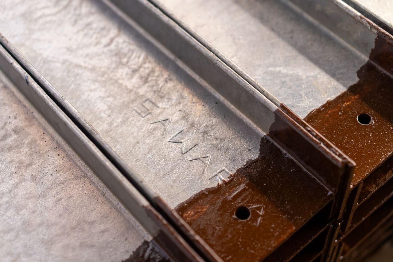 who-we-are Detailed view of rusty metal rails showcasing texture and industrial style.